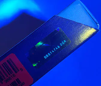 UV light revealing anti-counterfeiting code